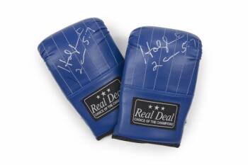 EVANDER HOLYFIELD SIGNED BAG GLOVES FROM HOME GYM