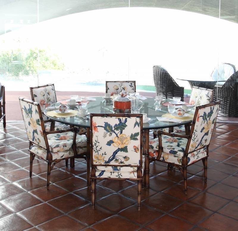 BAMBOO AND UPHOLSTERED DINING SUITE WITH GLASS TABLETOP