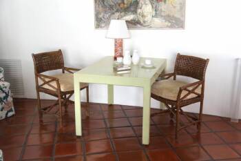 PAIR OF RATTAN ARMCHAIRS AND TABLE