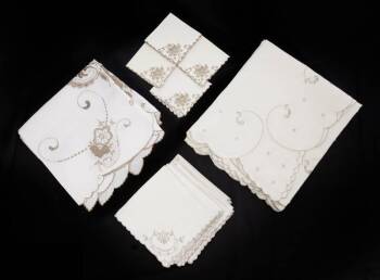 GROUP OF ECRU AND IVORY TABLE LINENS