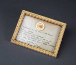 GRAIN OF RICE WITH WAR BOND INSCRIPTION