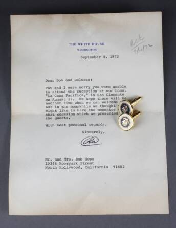 A PAIR OF PRESIDENTIAL SEAL CUFFLINKS PRESENTED TO BOB HOPE BY RICHARD NIXON