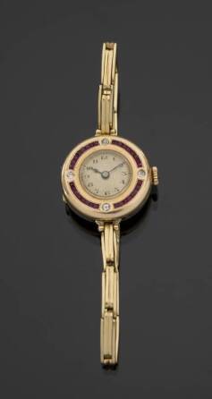 GRETA GARBO ART DECO GEMSTONE MANUAL WRISTWATCH DESIGNED IN 18K YELLOW GOLD