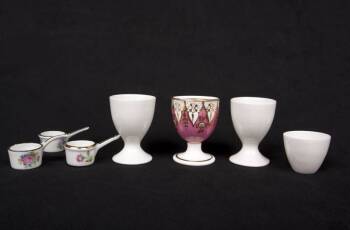 GRETA GARBO GROUP OF PORCELAIN EGG CUPS AND SOUVENIR POTS