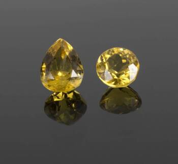 DOM DELUISE TWO UNMOUNTED HELIODOR GEMSTONES