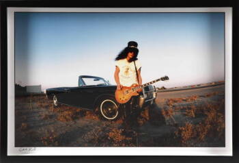 GENE KIRKLAND PHOTOGRAPH OF SLASH AND A LINCOLN CONTINENTAL