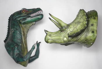 TWO WALL MOUNTED DINOSAUR HEADS