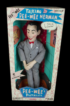 ELVIRA SIGNED TALKING PEE-WEE HERMAN DOLL, TELEGRAM FROM PAUL REUBENS, AND LIMITED EDITION REUBENS SIGNED BOOK