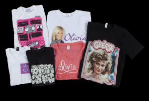OLIVIA NEWTON-JOHN COLLECTION OF T-SHIRTS, INCLUDING SIGNED GREASE T-SHIRT AND SIGNED IMAGES