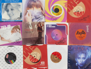 OLIVIA NEWTON-JOHN COLLECTION OF 45 RPM RECORDS, INCLUDES SIGNED