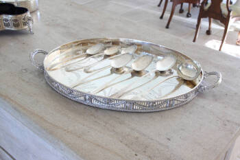 GROUP OF LARGE STERLING SERVING SPOONS AND A LADLE