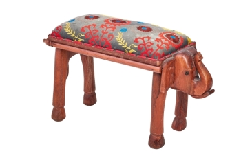 BETTY WHITE: CARVED WOOD AND EMBROIDERED ELEPHANT BENCH