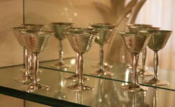 A SET OF EIGHT STERLING GOBLETS AND SIX VERMEIL TEASPOONS