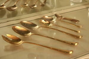 ALAIN SAINT-JOANIS FLATWARE AND SERVE WARE TOGETHER WITH A SET OF GILDED SERVING SPOONS