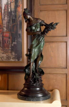 A CAST BRONZE FIGURE AFTER AUGUSTE MOREAU