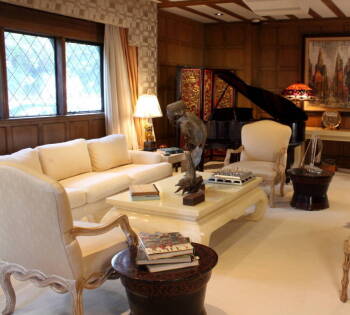 TWO LIVING ROOM TABLES AND A PAIR OF SILK UPHOLSTERED CARVED WOODEN ARMCHAIRS AND SOFA