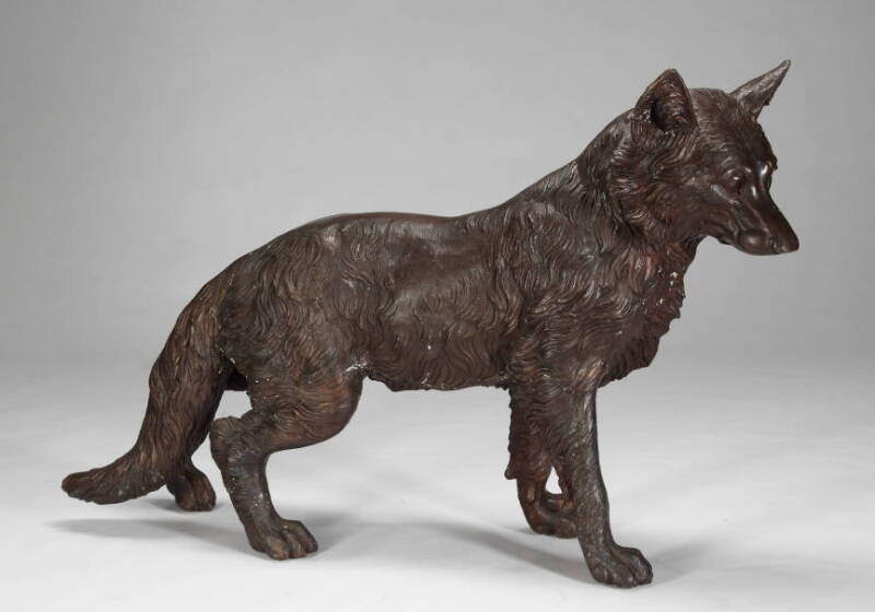 A BRONZE WOLF STATUE