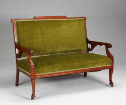 AN EASTLAKE STYLE GREEN VELVET LOVESEAT