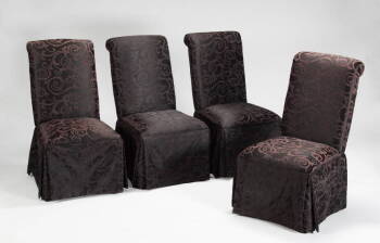 A SET OF FOUR UPHOLSTERED SIDE CHAIRS