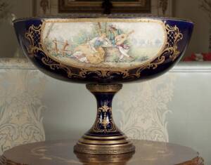 PAINTED SEVRES STYLE OVAL FOOTED URN