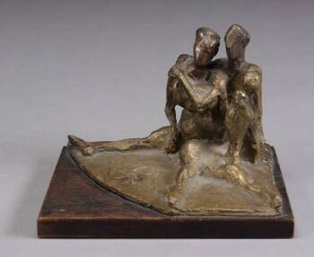 A BRONZE OF MAN AND WOMAN