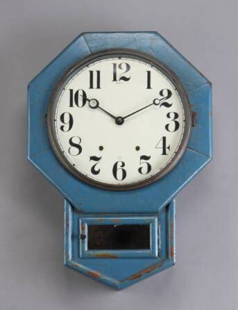 A WOODEN OCTAGONAL CLOCK