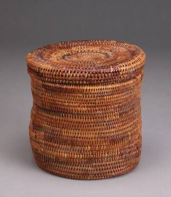 A COILED CYLINDRICAL LIDDED BASKET