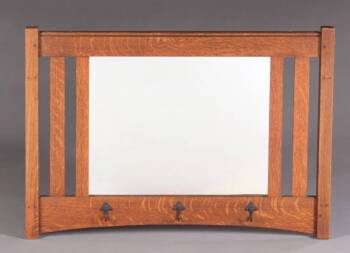 A CHARLES LIMBERT WALL MIRROR WITH HOOKS