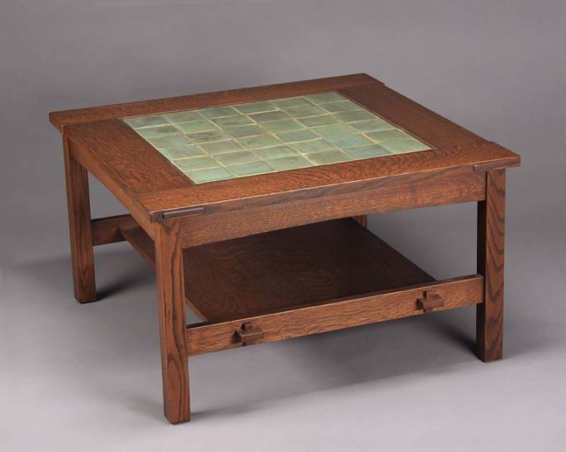 A PAIR OF ARTS AND CRAFTS STYLE GREEN TILE TOP COFFEE TABLES