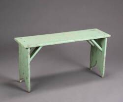 A RUSTIC GREEN WOODEN BENCH