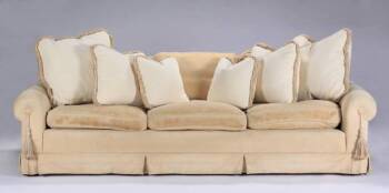 A MODERN THREE-SEAT UPHOLSTERED SOFA