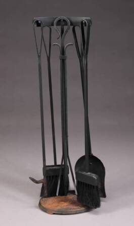 A SET OF BLACK IRON FIRE TOOLS