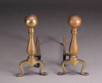 A PAIR OF BRASS BALL TOP ANDIRONS AND FIREPLACE TOOLS