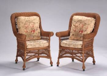 A SET OF FOUR WILLOW STYLE WICKER ARM CHAIRS