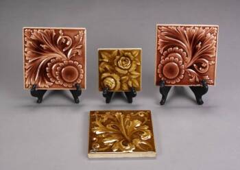 A GROUP OF FOUR AMERICAN ENCAUSTIC TILE CO. TILES