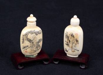 A PAIR OF CARVED AND ENGRAVED IVORY SNUFF BOTTLES