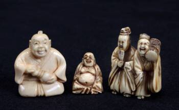 A GROUP OF THREE ASSORTED NETSUKE FIGURINES