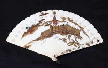 AN ELABORATELY DECORATED JAPANESE IVORY FAN