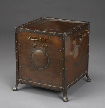 A PATINATED METAL COAL BIN