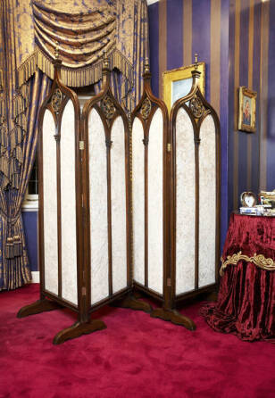 A PAIR OF GOTHIC STYLE CARVED SCREENS