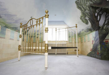 A VICTORIAN WHITE PAINTED AND BRASS BED