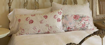 TWO FLORAL CHINTZ PILLOWS