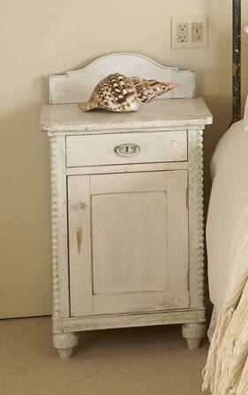 A DISTRESSED PAINTED NIGHTSTAND CABINET