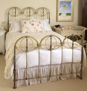 A VICTORIAN STYLE WROUGHT IRON DOUBLE BED
