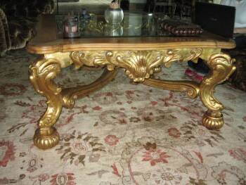 CHER - A BAROQUE STYLE GILTWOOD LOW TABLE