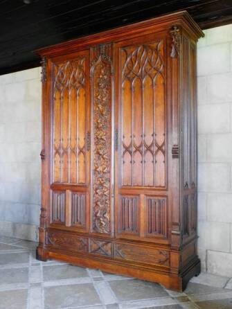 CHER - A GOTHIC REVIVAL OAK CUPBOARD