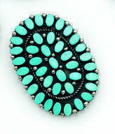 CHER - A TURQUOISE STONE BROOCH