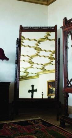 CHER - A GOTHIC REVIVAL OAK CHEVAL MIRROR