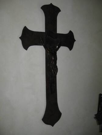 CHER - A WOOD AND PATINATED-METAL CRUCIFIX