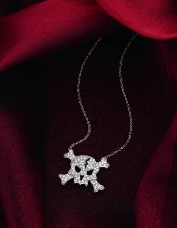 CHER - DIAMOND SKULL & CROSSBONES NECKLACE